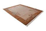 Vintage Art Deco carpet's light field and copper border adorned with floral sprays and lotus flowers.