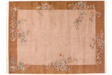 Art Deco carpet with dusty mauve field, copper border, and floral lotus sprays.