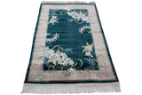 Ivory fringe and high sheen hunter green end border, vintage Art Deco rug.