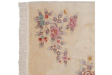 Art Deco floral spray with pink, blue, mauve blossoms, cream field, and light fringe.