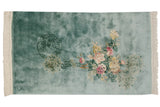 Vintage Japanese Peking design rug with pale aqua blue ground, floral bouquet, and pictorial roundel.
