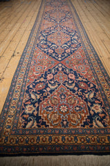 Full length perspective of a collector's Persian Tabriz runner showing its series of medallions.