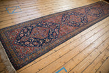 Full perspective of the vintage Tabriz runner, highlighting its scale and repeating medallion design.