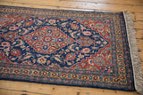 Original side cord selvage and clean ivory fringe on the corner of a vintage Tabriz runner.