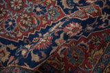 A soft fold in the Tabriz runner reveals a dense, even pile and intricate floral blossoms.