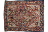 Collector vintage Bakshaish carpet with a large red medallion, serrated leaves, and a sapphire blue outer border.