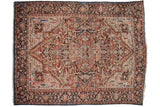 Sprawling floral arabesques in the corner spandrels of a vintage Bakshaish carpet with an abrashed sapphire blue border.