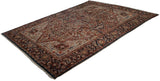 Angled view of a collector Bakshaish carpet showing its large medallion and sprawling floral design.