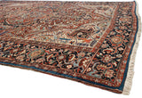 Intricate floral arabesques and a navy border with a unique solid sapphire blue outer edge on a collector Bakshaish carpet.