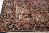 Corner spandrel of a vintage Bakshaish carpet featuring intricate arabesques and a sapphire blue border.