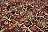 Detail of finned vines and stylized floral motifs on a collector's vintage Bakshaish carpet.