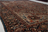Original sapphire blue side cord and intricate corner arabesques on a hand-knotted Collector Bakshaish carpet.