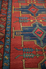 Detail of arrowed finials and the meandering leaf border on an antique Northwest Persian runner.