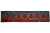 Antique Persian runner with stepped blue medallions on a red field, framed by a meandering leaf border.