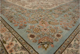 Plush hand-knotted pile on the powder blue corner of a vintage Tabriz with floral sprays.