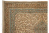 Weaver's insignia in the floral minor border of a vintage Tabriz carpet with Rococo scrolling.