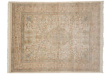 Pictorial scene of birds and antelope within the intricate floral border of a Tabriz carpet.