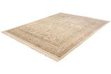 Angled view of the vintage Tabriz carpet, showcasing its ivory field, intricate borders, and neat fringe.
