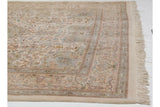 Corner of a vintage Persian Tabriz carpet highlighting the intact side cord selvage and plush, full pile.