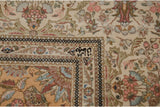 A weaver's insignia woven into the minor border of a vintage Tabriz carpet with a plush, full pile.