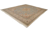 The full square layout of a vintage Tabriz carpet featuring a powder blue field and ivory floral border.