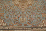 Perched peacocks amidst blossomed branches on the powder blue field of a vintage Persian Tabriz rug.