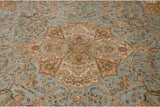 Perched peacocks and intricate floral branches on the powder blue field of a vintage Tabriz rug.