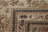 Weaver's insignia detail in the minor border corner of a vintage Persian Tabriz carpet.