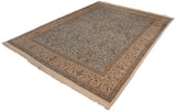 Vintage Tabriz carpet corner showcasing fringe and beige border with deer and cypress trees.