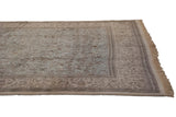Vintage Tabriz carpet showing forest scene with deer, birds; powder blue and beige tones.