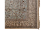 Blossomed ivory border with cypress trees and deer on powder blue vintage Tabriz rug.