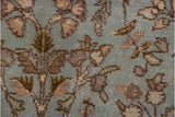 Powder blue pile detail of vintage Tabriz rug, with rose and brown botanical motifs.