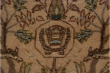 Distinctive Cyrus Crown trademark motif in powder blue and chocolate brown on vintage Tabriz pile.