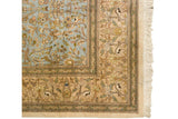 Detailed corner of a pictorial Tabriz showing deer in the beige border and cream fringe.