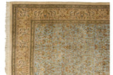 Detail of a vintage Tabriz corner showing the beige border with deer and pale blue pictorial field.
