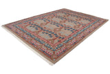 The full sprawling branch design of the vintage Arts and Crafts carpet, viewed from a high corner angle.