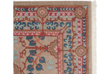 Carved texture on the blue and pink floral border of a vintage Indian Arts and Crafts carpet.