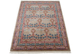 The complete Arts and Crafts trellis design of a vintage Indian carpet shown from a perspective angle.