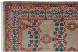 Detail of the carved pile texture on an Arts and Crafts Indian carpet with floral borders.