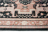 Serapi-inspired rug's shallow carved contour reveals terracotta, pale rose, and charcoal motifs.