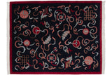 Vintage Indian Peking design rug with carved cloudbands on a navy field and a bold red border.