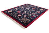 Angled view of a vintage Indian carpet highlighting the carved pile around its Peking design motifs.