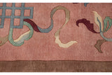 Carved dusty blush pile with blue endless knots and multicolor ribboned cloudband elements.