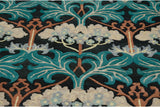 Symmetrical Arts and Crafts tree motif with teal leaves and blossoms on a charcoal black field.