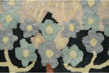 Dense, even pile of a hand-knotted carpet showing arts and crafts floral blossoms.
