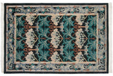 The full composition of a vintage William Morris rug, showing the main field and coordinating floral border.