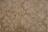Close-up of beige and cream Savonnerie rug with shallow carved tone-on-tone floral motifs.