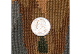 Hand-knotted Savonnerie rug detail. Quarter shows coffee brown, oxidized silver, green pile.