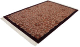 Vintage carpet, terracotta field, Rococo vinery, floral motifs, carved contour, burgundy border.