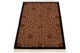 Shallow carved Rococo vinery in ivory, terracotta, and green on vintage Indian European rug.